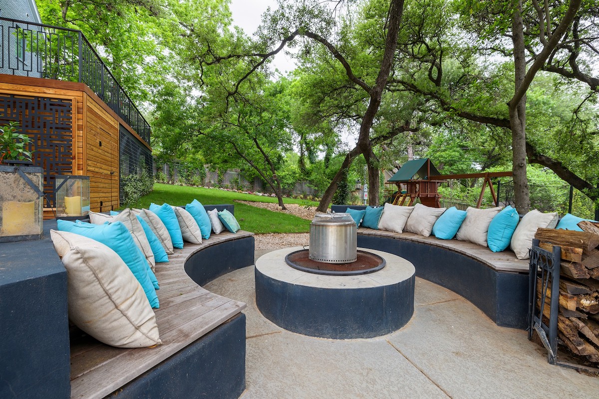 fire pit and outdoor seating for outdoor living installation in backyard