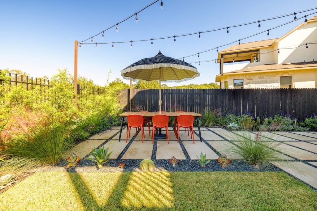 Backyard landscape design and patio extension by Best of Texas Landscapes, near Leander, TX
