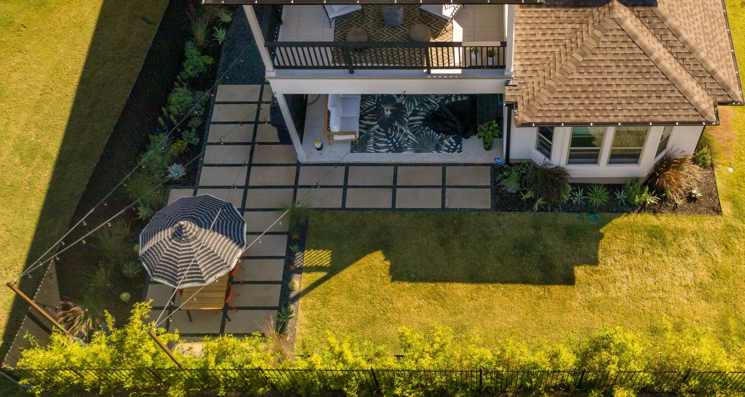 aerial view of patio extension made with large pavers and new plants
