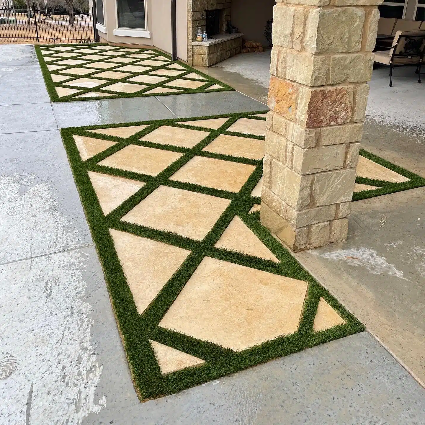 stone and turf patio extension accents