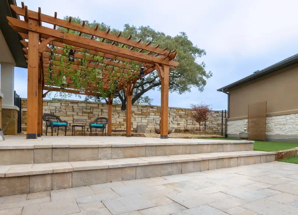 patio extension with raised pergola on inclined backyard in Georgetown Texas