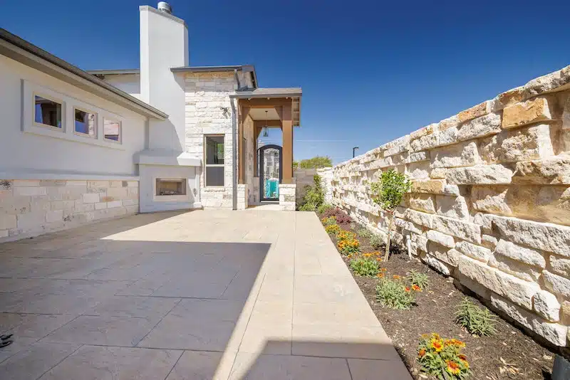 stone patio landscaping for condo backyard in Georgetown, Texas