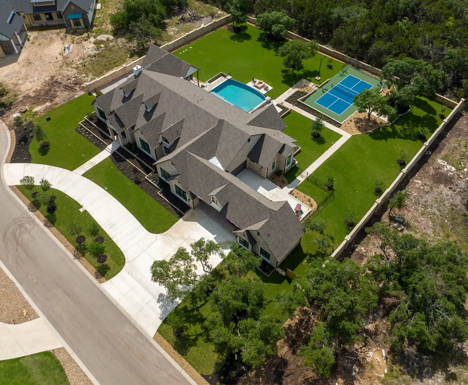 aerial view of front and backyard luxury landscaping by Best of Texas Landscapes